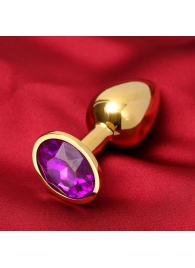 Золотистая анальная пробка с фиолетовым кристаллом - Сима-Ленд - купить с доставкой в Ессентуках